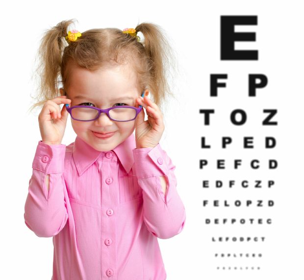 Copyright: andreykuzmin / 123RF Stock Photo Child wearing spectacles next to reading chart